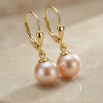 Cercei cu sistem de închidere tip tortiță din aur 14K galben cu perlă roz