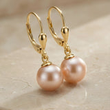 Cercei cu sistem de închidere tip tortiță din aur 14K galben cu perlă roz